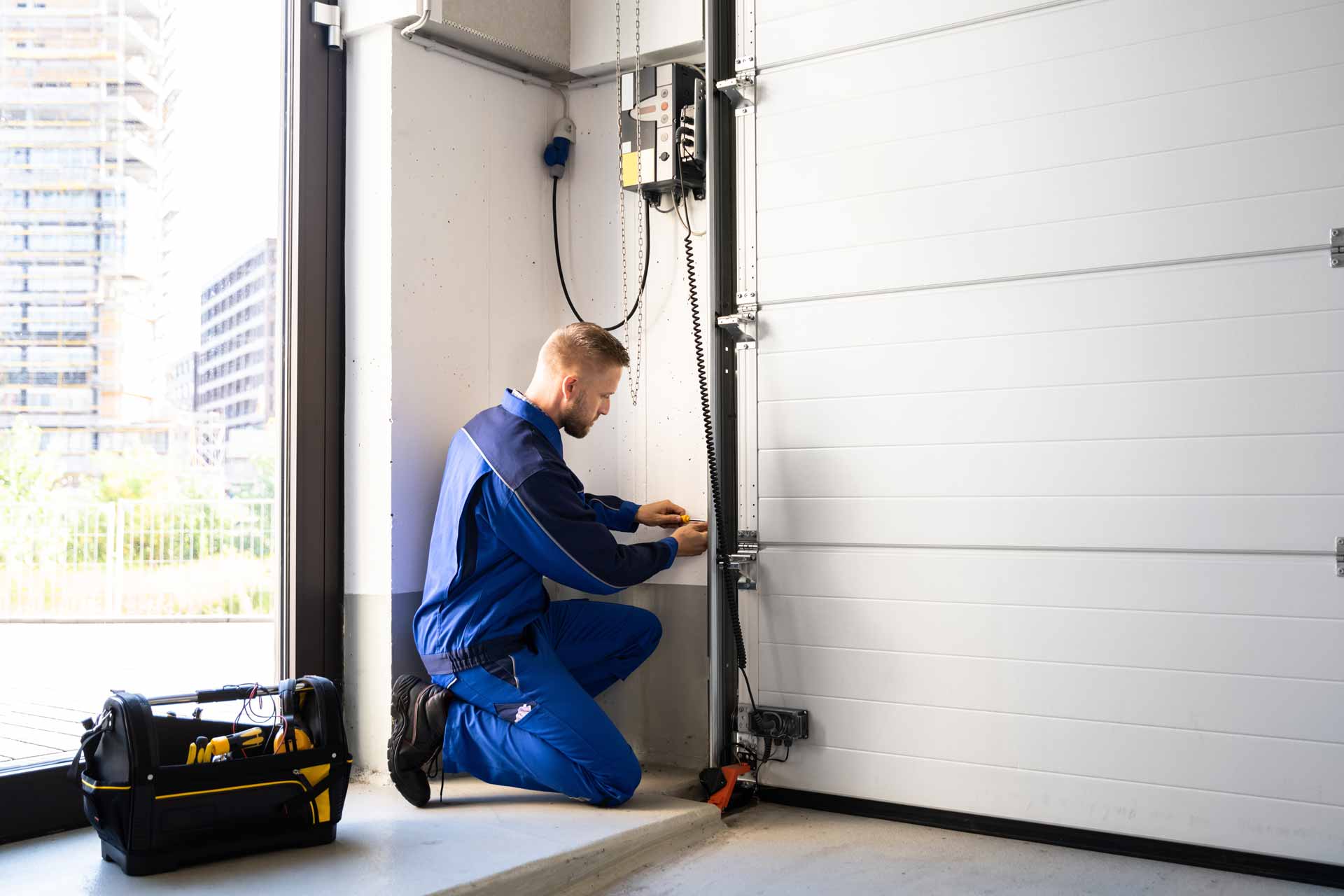 Garage door repair technician at work